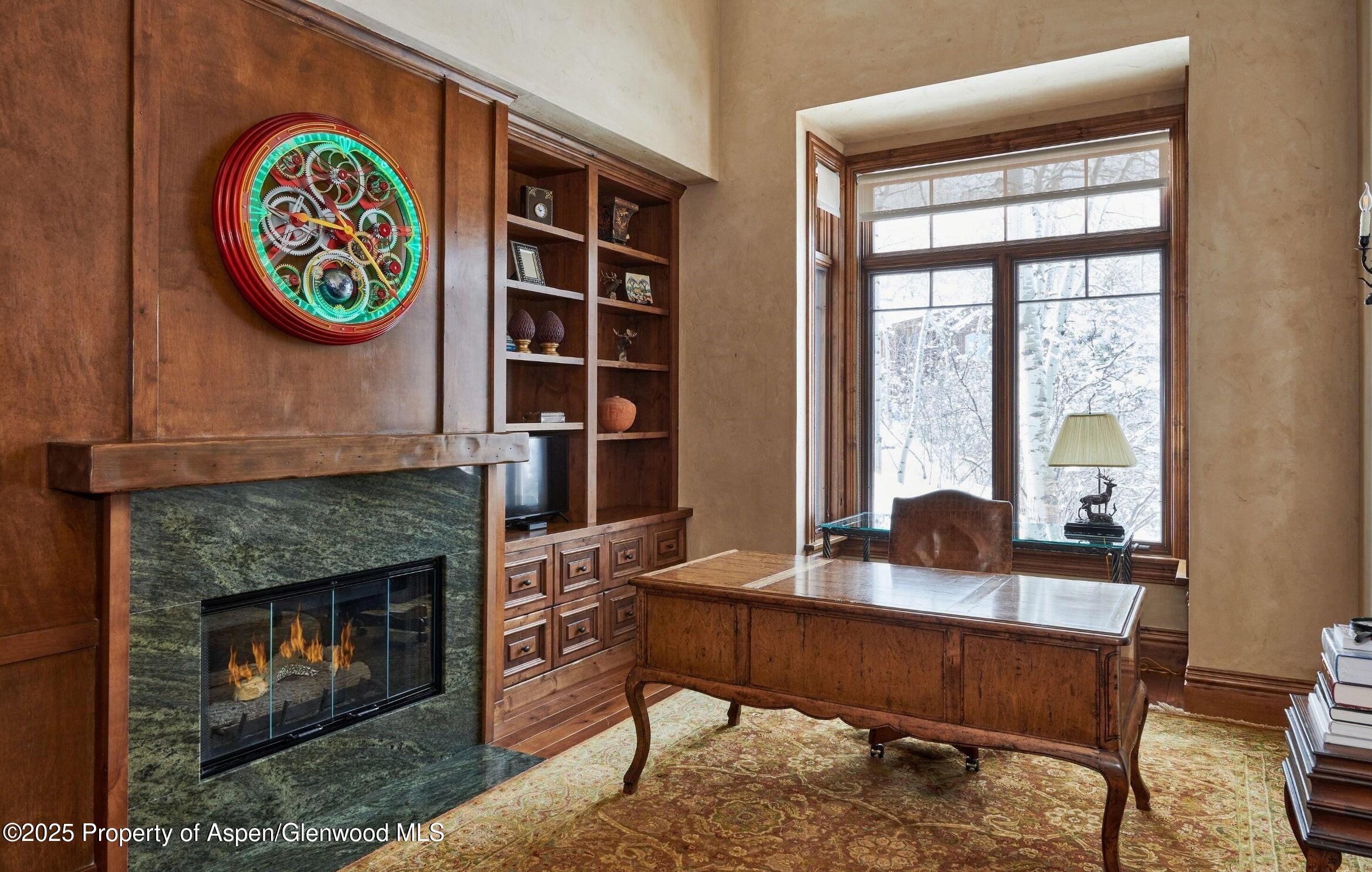64 Spruce Ridge Lane Snowmass Village, CO 81615 - Photo 19 of 38 a living room with furniture and a fireplace