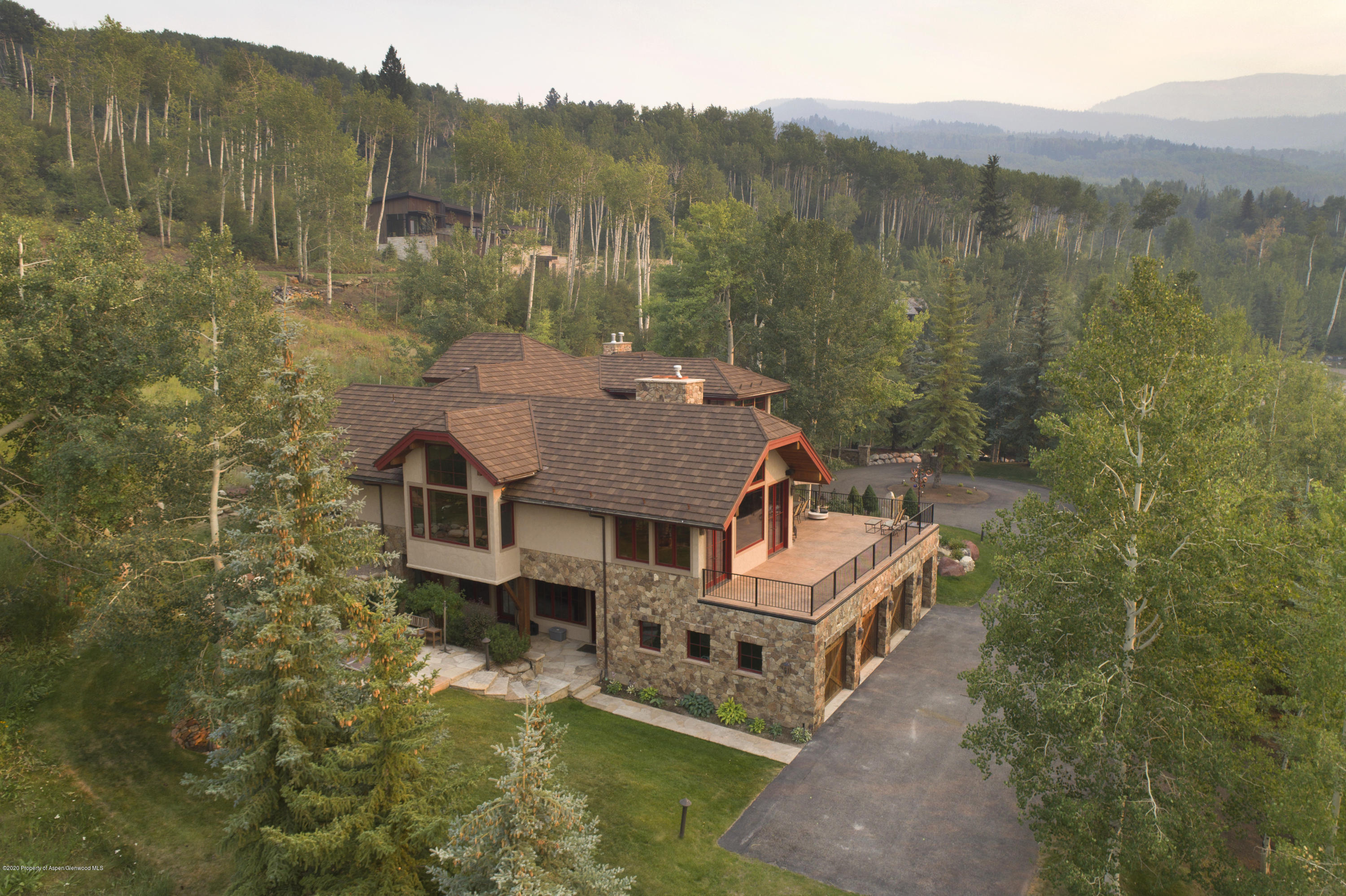 64 Spruce Ridge Lane Snowmass Village, CO 81615 - Photo 3 of 38 a aerial view of a house with a big yard