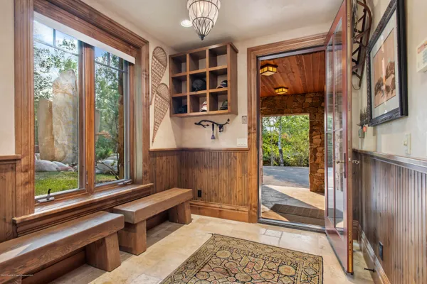 a room with pool table and windows