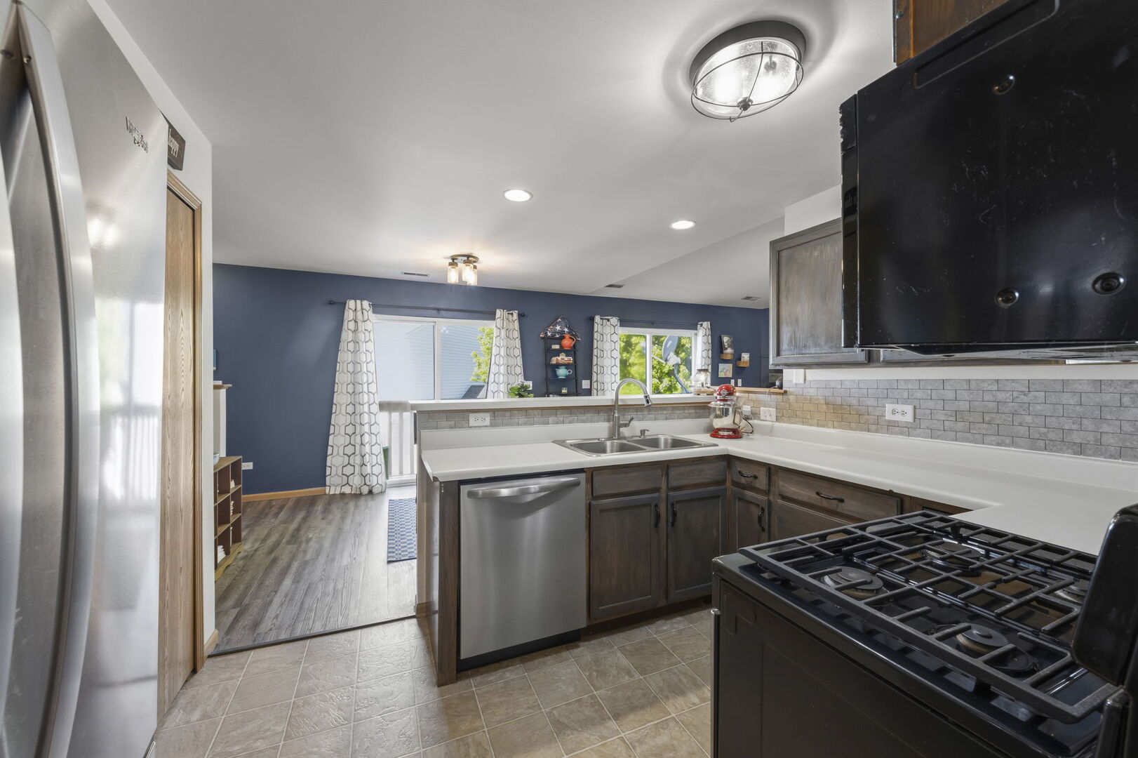 965 Constance Lane, Unit G Sycamore, IL 60178 - Photo 15 of 25 a kitchen with stainless steel appliances granite countertop a stove and a sink