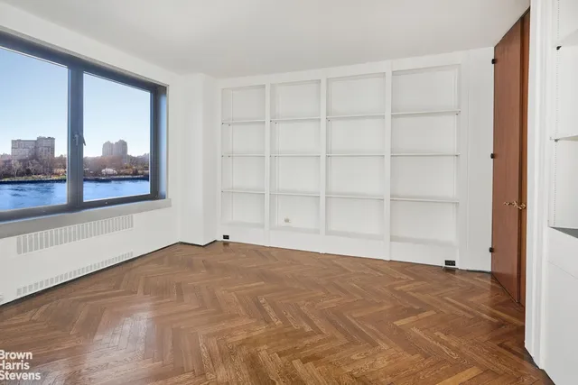 a view of an empty room with a window