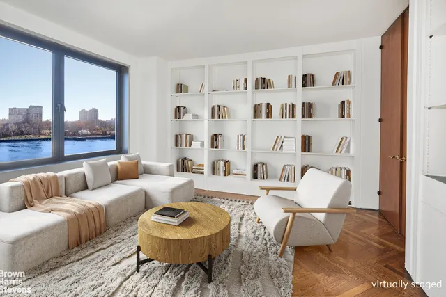 a living room with furniture and a rug
