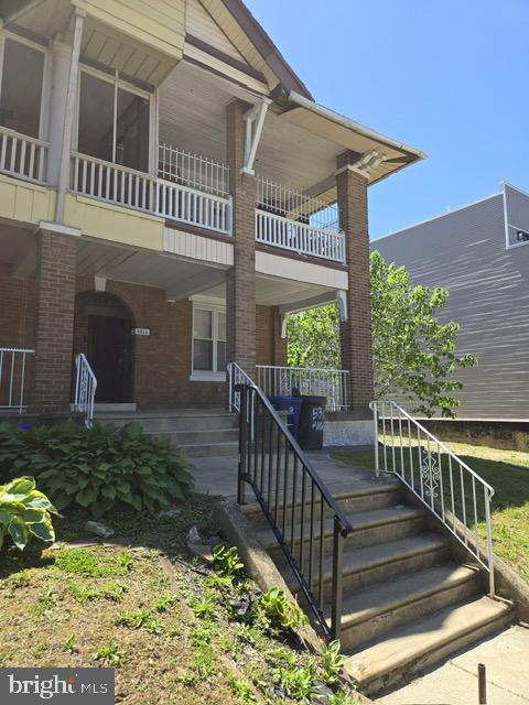 a view of a porch with a small yard
