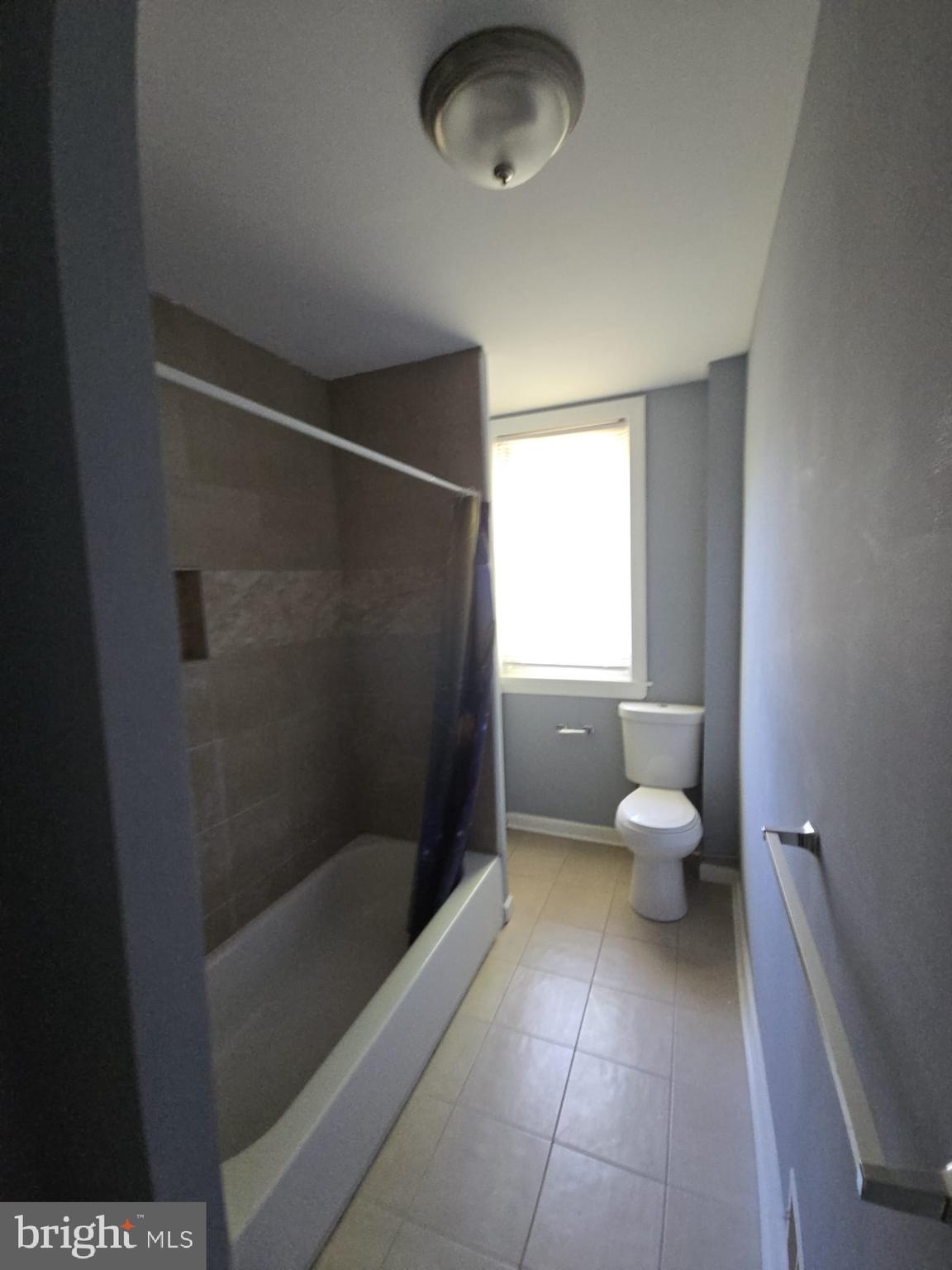 5314 Angora Terrace, Unit 1 Philadelphia, PA 19143 - Photo 11 of 15 a bathroom with a toilet and a shower