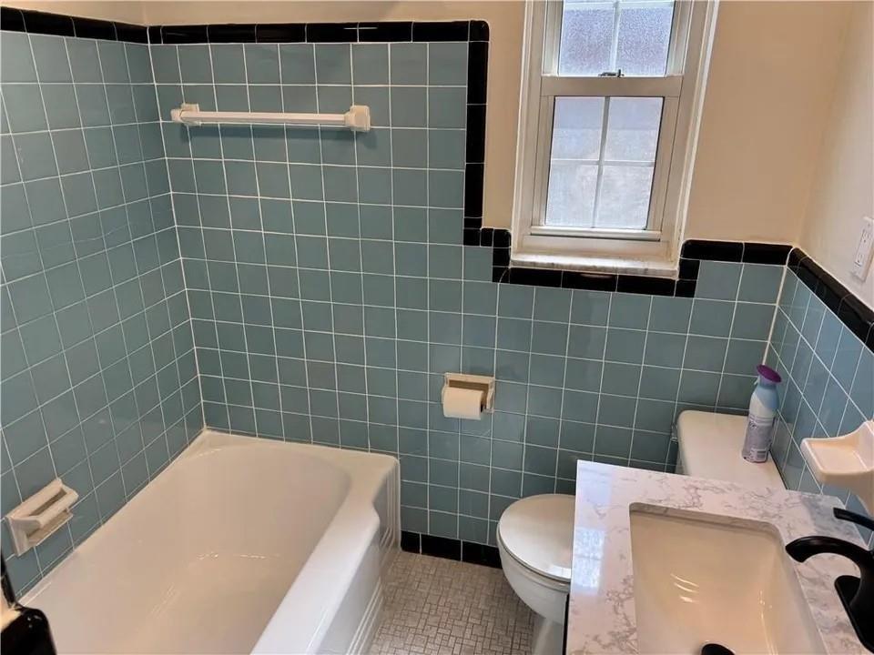 2251 Montgomery Road Sewickley, PA 15143 - Photo 14 of 36 a bathroom with a sink a toilet and a mirror