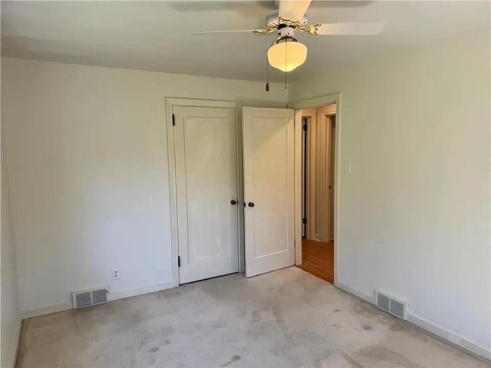 2251 Montgomery Road Sewickley, PA 15143 - Photo 20 of 36 a view of a room with a chandelier fan and closet