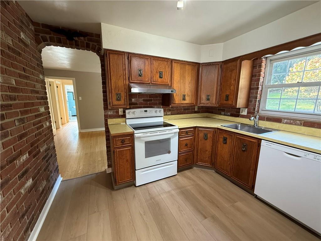 2251 Montgomery Road Sewickley, PA 15143 - Photo 9 of 36 a kitchen with a stove top oven sink and cabinets