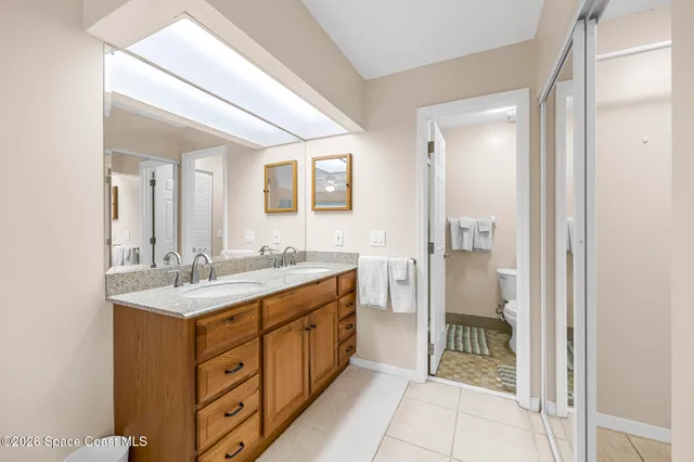 a bathroom with a sink a mirror and a bathtub