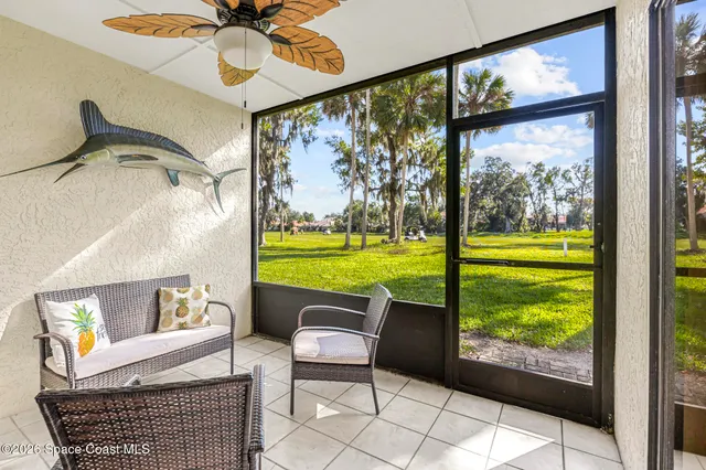 a view of living room with furniture and garden view