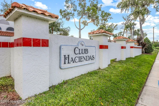 a view of outdoor space with signage and flags