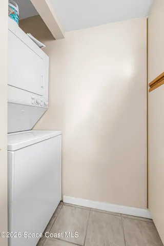 a view of storage and utility room with washer and dryer