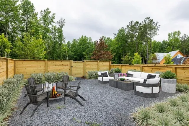 a view of a lake with couches and wooden floor