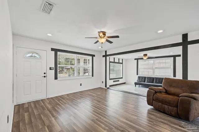 a living room with furniture and a large window