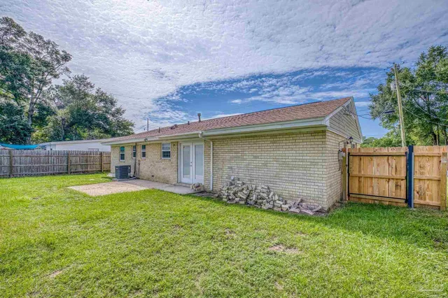 a backyard of a house with lots of green space