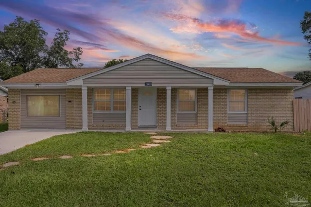 front view of a house with a yard