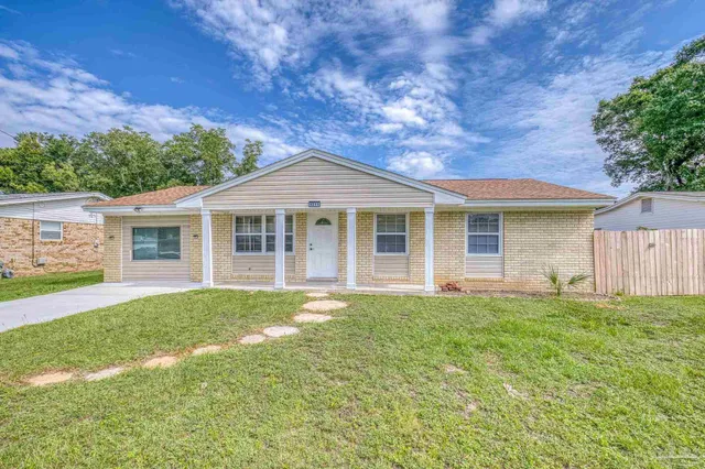 front view of a house with a yard
