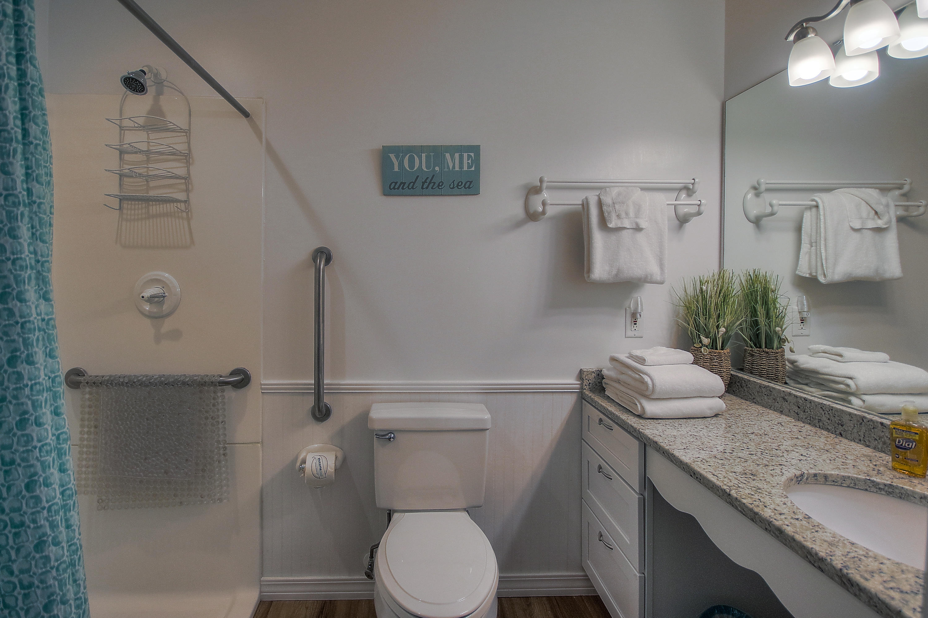 105 Garfield Street Santa Rosa Beach, FL 32459 - Photo 11 of 30 a bathroom with a granite countertop sink toilet and shower