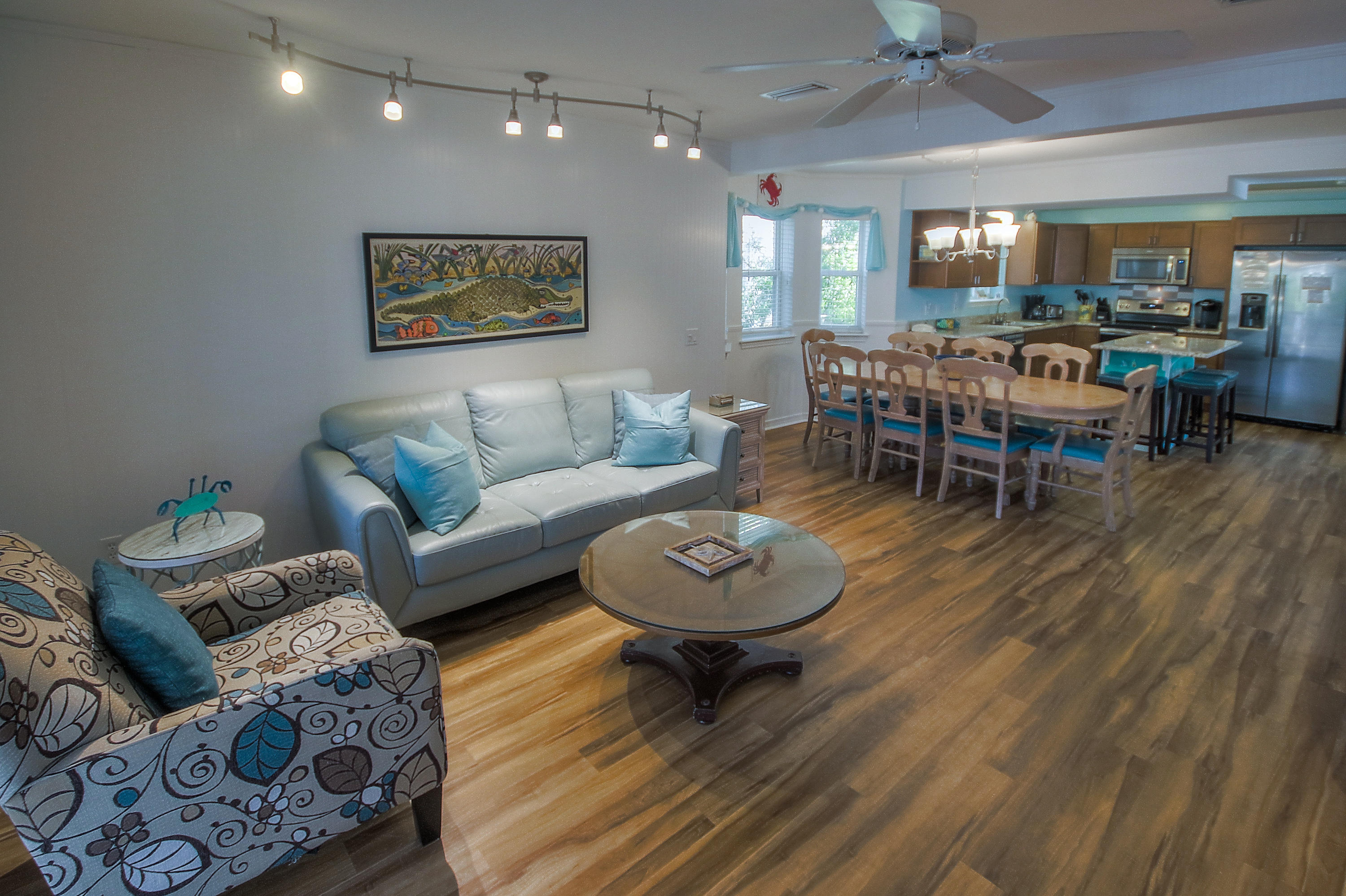 105 Garfield Street Santa Rosa Beach, FL 32459 - Photo 3 of 30 a living room with furniture and a wooden floor