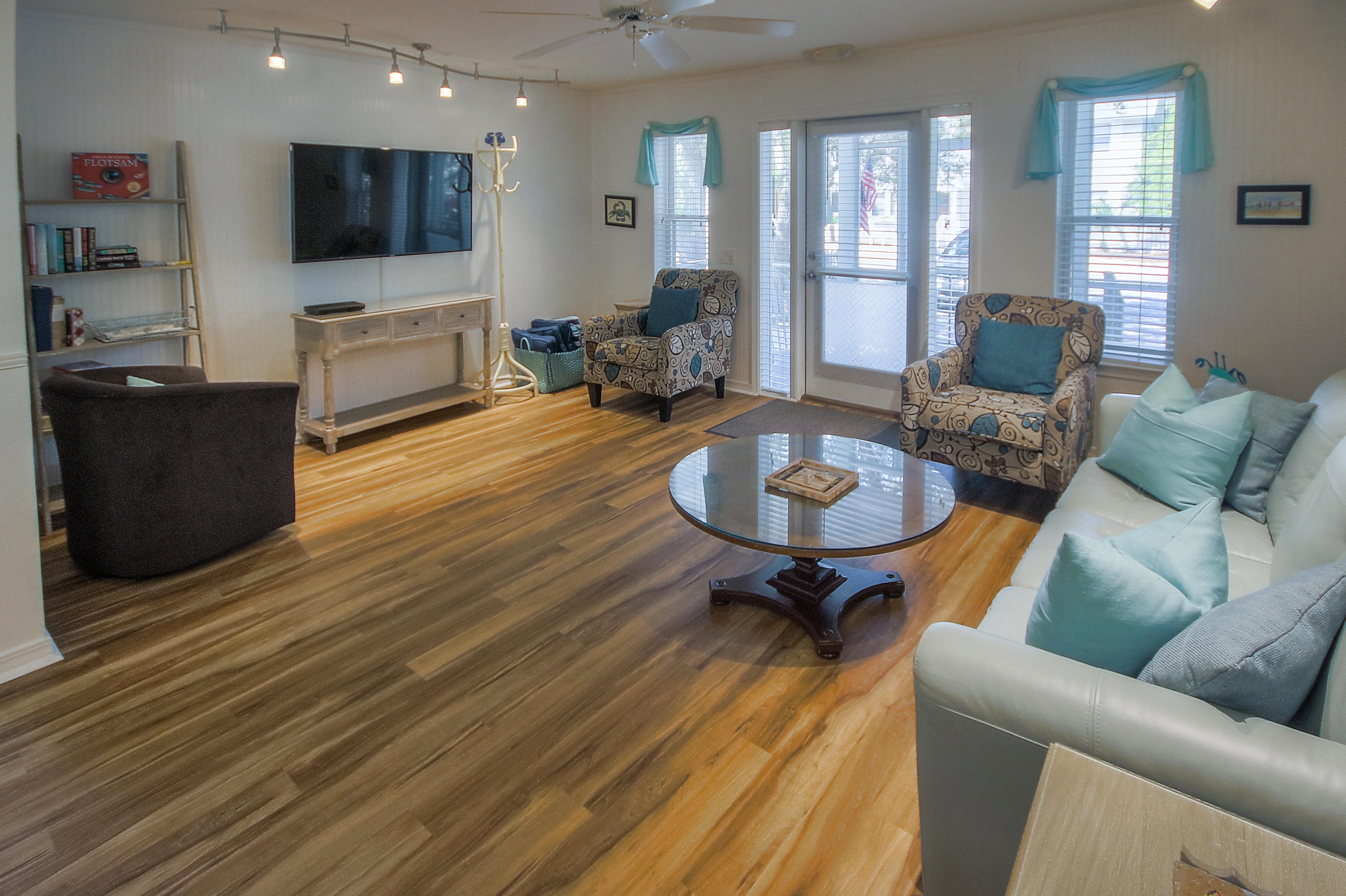 105 Garfield Street Santa Rosa Beach, FL 32459 - Photo 8 of 30 a living room with furniture and a flat screen tv