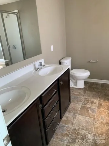 a bathroom with a sink and a toilet