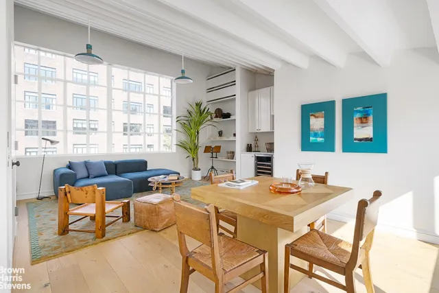 a view of a dining room with furniture window and outside view