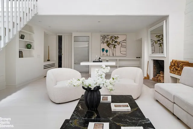 a living room with furniture flowerpot and window