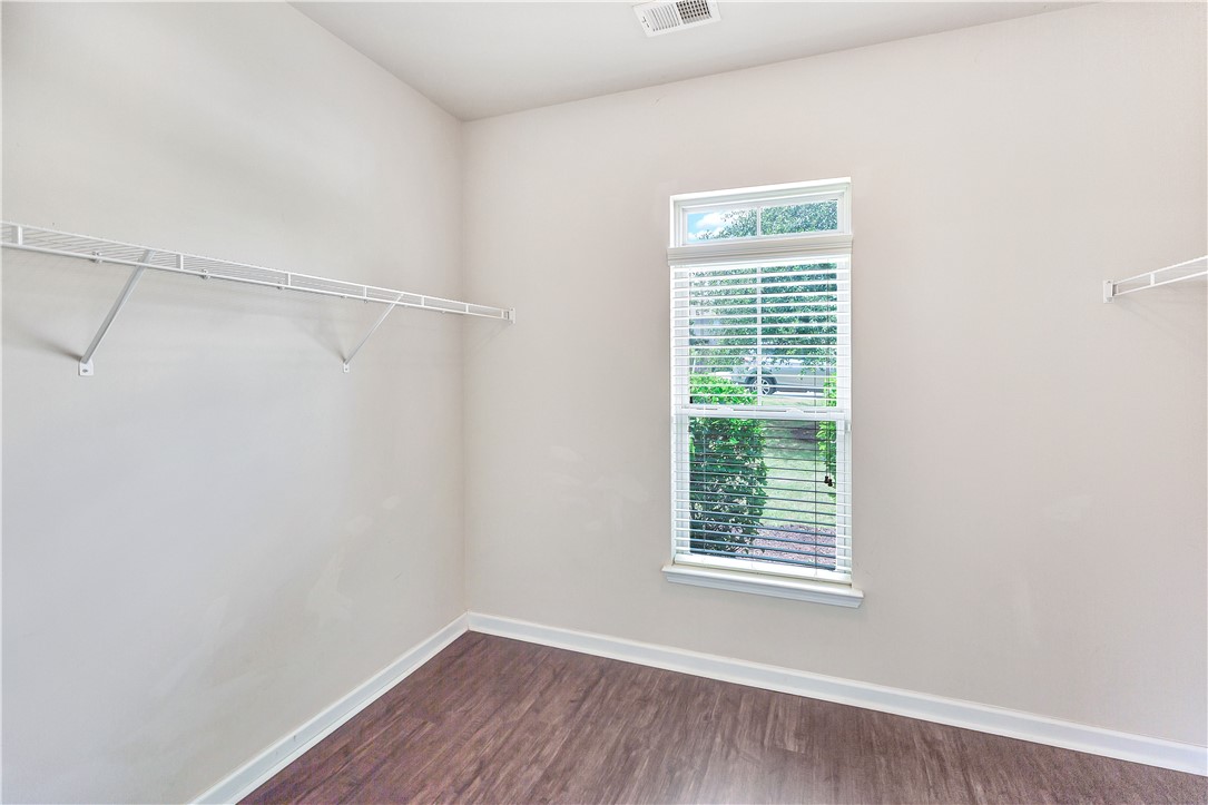 144 Buckland Drive Anderson, SC 29621 - Photo 10 of 48 A well-lit closet offers ample storage with durable shelving and a view of the surrounding greenery.