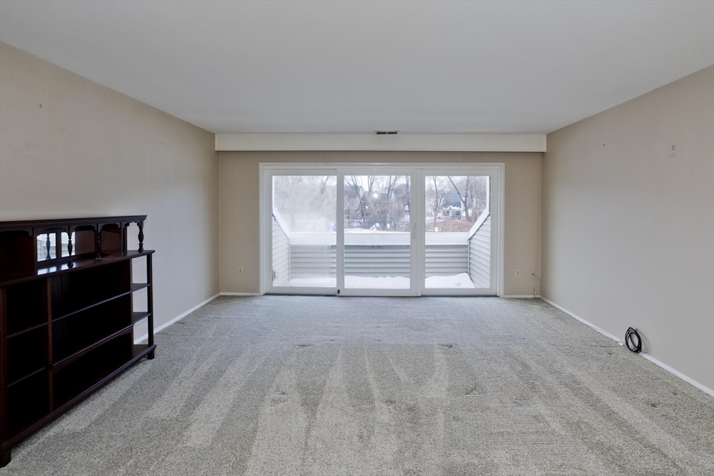 169 Nassau Drive, Unit 169 Springfield, MA 01129 - Photo 14 of 31 a view of an empty room with a window