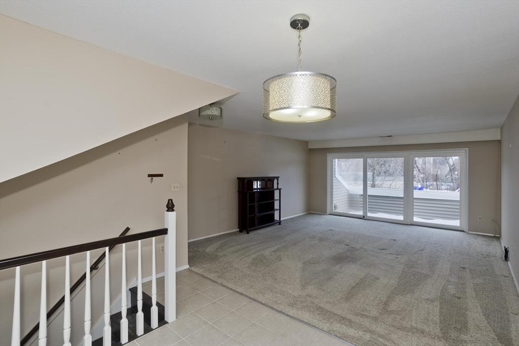 169 Nassau Drive, Unit 169 Springfield, MA 01129 - Photo 6 of 31 a view of an empty room with a window