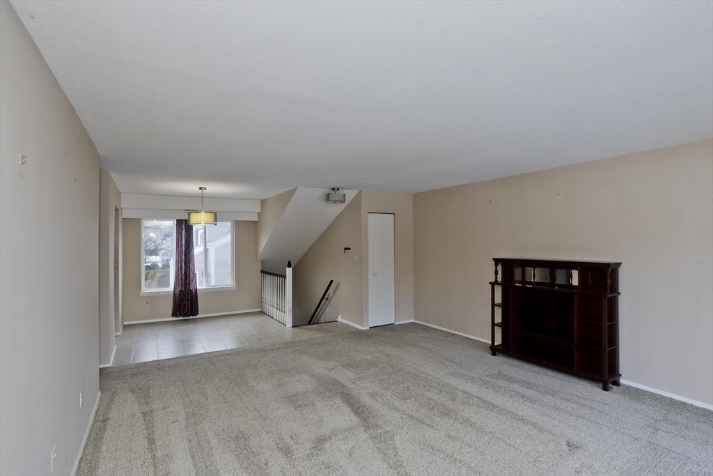 169 Nassau Drive, Unit 169 Springfield, MA 01129 - Photo 8 of 31 a view of empty room with windows