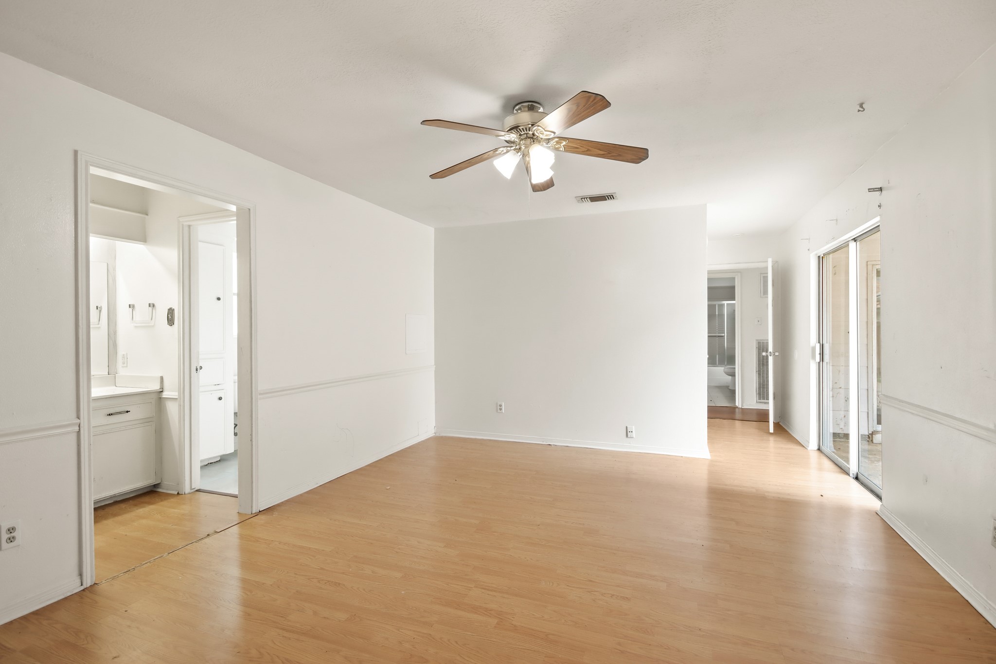 6919 River Mill Drive Spring, TX 77379 - Photo 15 of 26 From the Primary Suite sliding doors lead to the covered patio area.