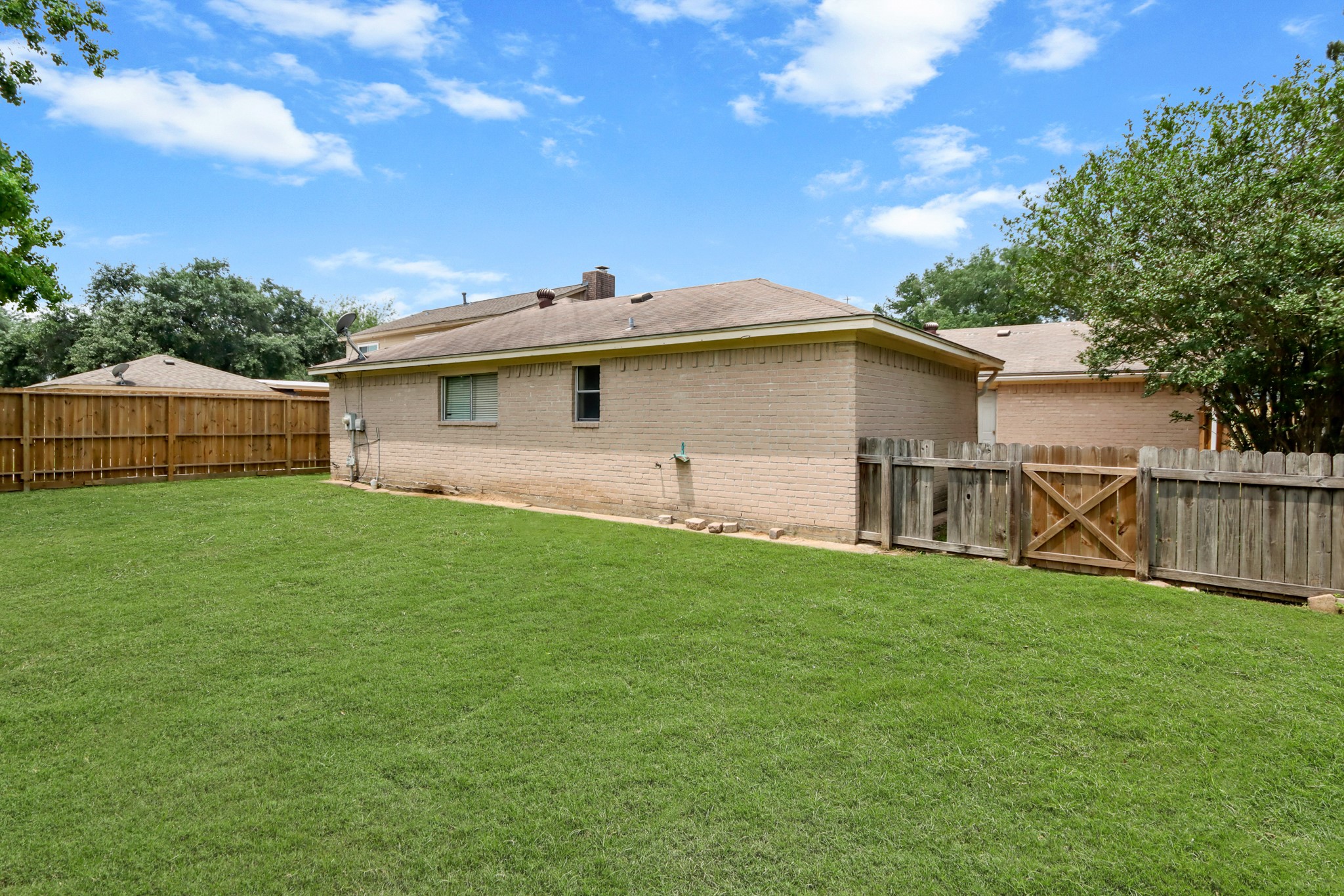6919 River Mill Drive Spring, TX 77379 - Photo 24 of 26 Large backyard with plenty of room for outdoor entertaining, gardening, or future enhancements.