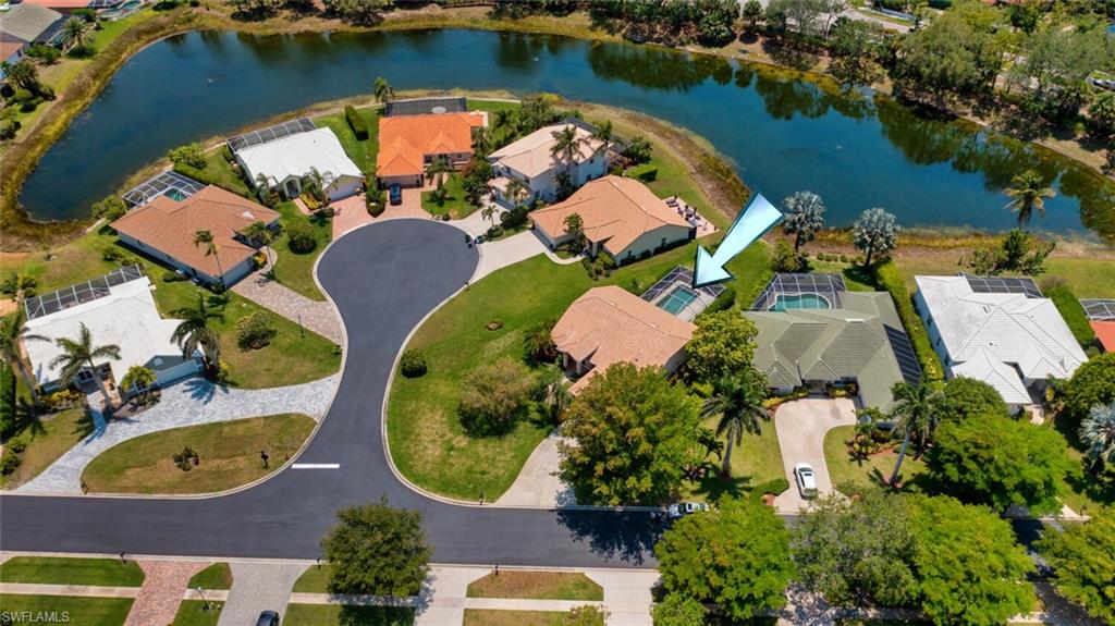 1946 Timberline Drive Naples, FL 34109 - Photo 1 of 19 an aerial view of residential houses with outdoor space and lake view
