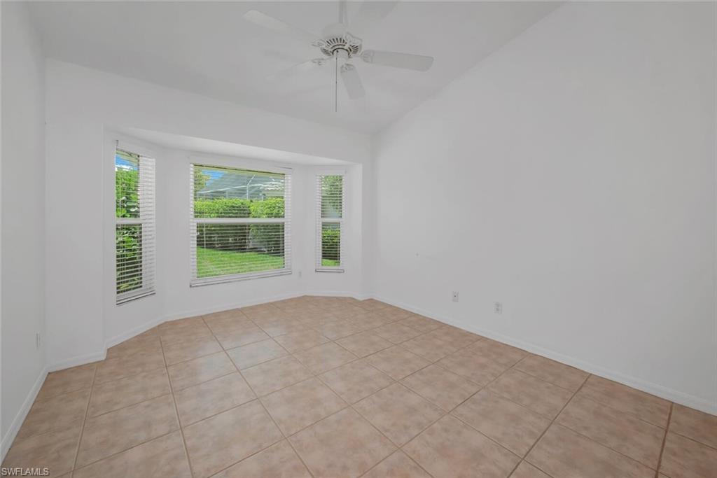 1946 Timberline Drive Naples, FL 34109 - Photo 13 of 19 an empty room with windows and closet
