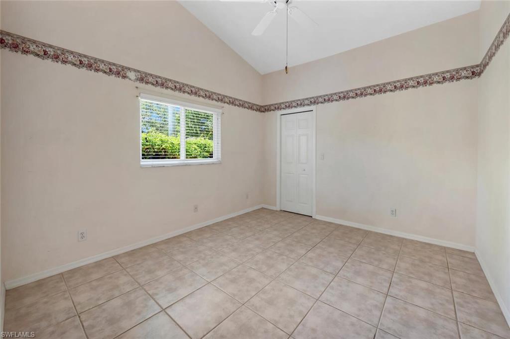 1946 Timberline Drive Naples, FL 34109 - Photo 14 of 19 a view of an empty room with a window