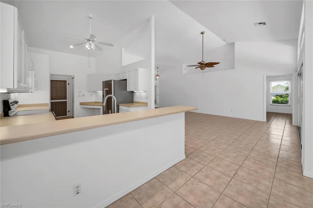 1946 Timberline Drive Naples, FL 34109 - Photo 17 of 19 a view of a kitchen with cabinets and a sink