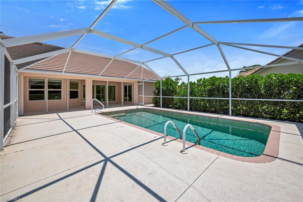 1946 Timberline Drive Naples, FL 34109 - Photo 18 of 19 a view of a house with backyard and porch