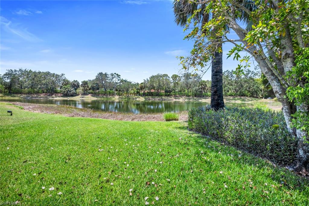1946 Timberline Drive Naples, FL 34109 - Photo 5 of 19 a view of a lake with houses in the back