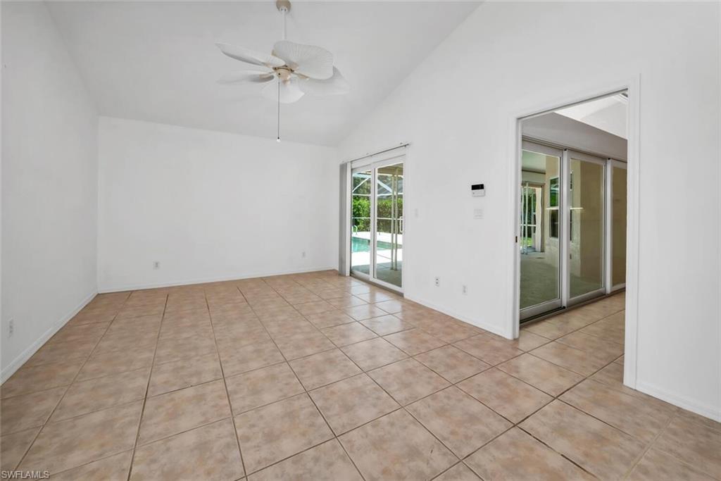 1946 Timberline Drive Naples, FL 34109 - Photo 6 of 19 an empty room with fan and windows