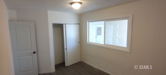137 South Sunland Street Ridgecrest, CA 93555 - Photo 11 of 18 an empty room with windows and closet