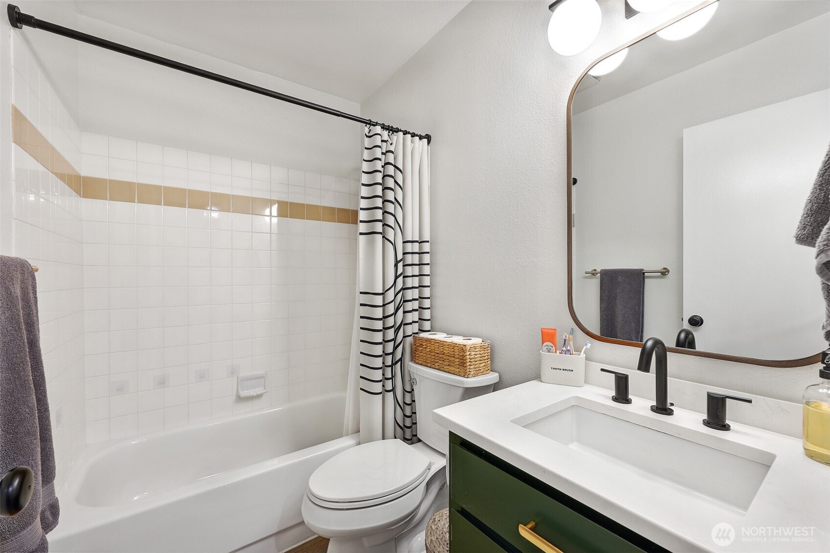 5126 South Garden Loop Road, Unit 11 Seattle, WA 98118 - Photo 27 of 36 a bathroom with a granite countertop sink toilet and shower