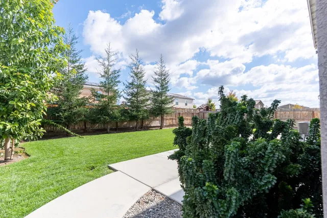 an aerial view of a house with a garden