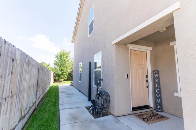 a view of a entryway door with wooden floor