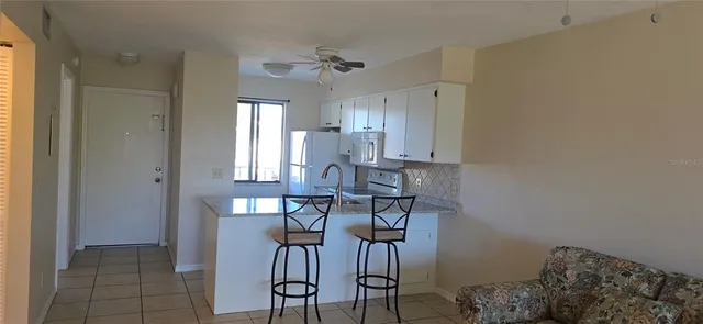 a view of a kitchen with appliances and cabinets