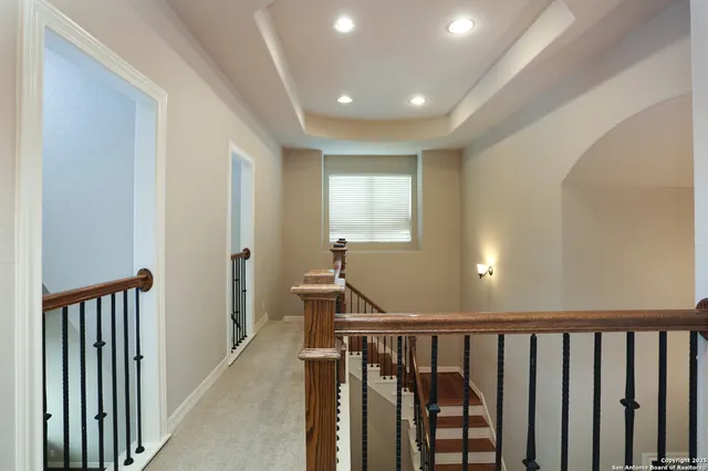 a view of a hallway with windows