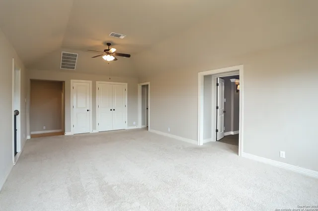 a view of empty room with fan