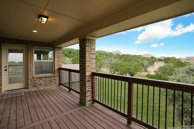 a view of balcony with wooden floor