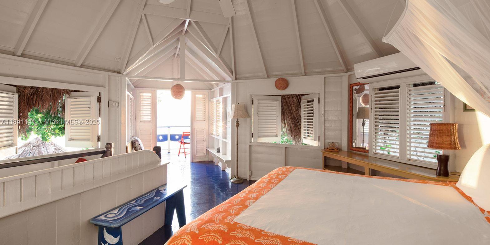 144 One Love Drive undefined, - 00000 - Photo 11 of 34 a bed room with a bed and a large window