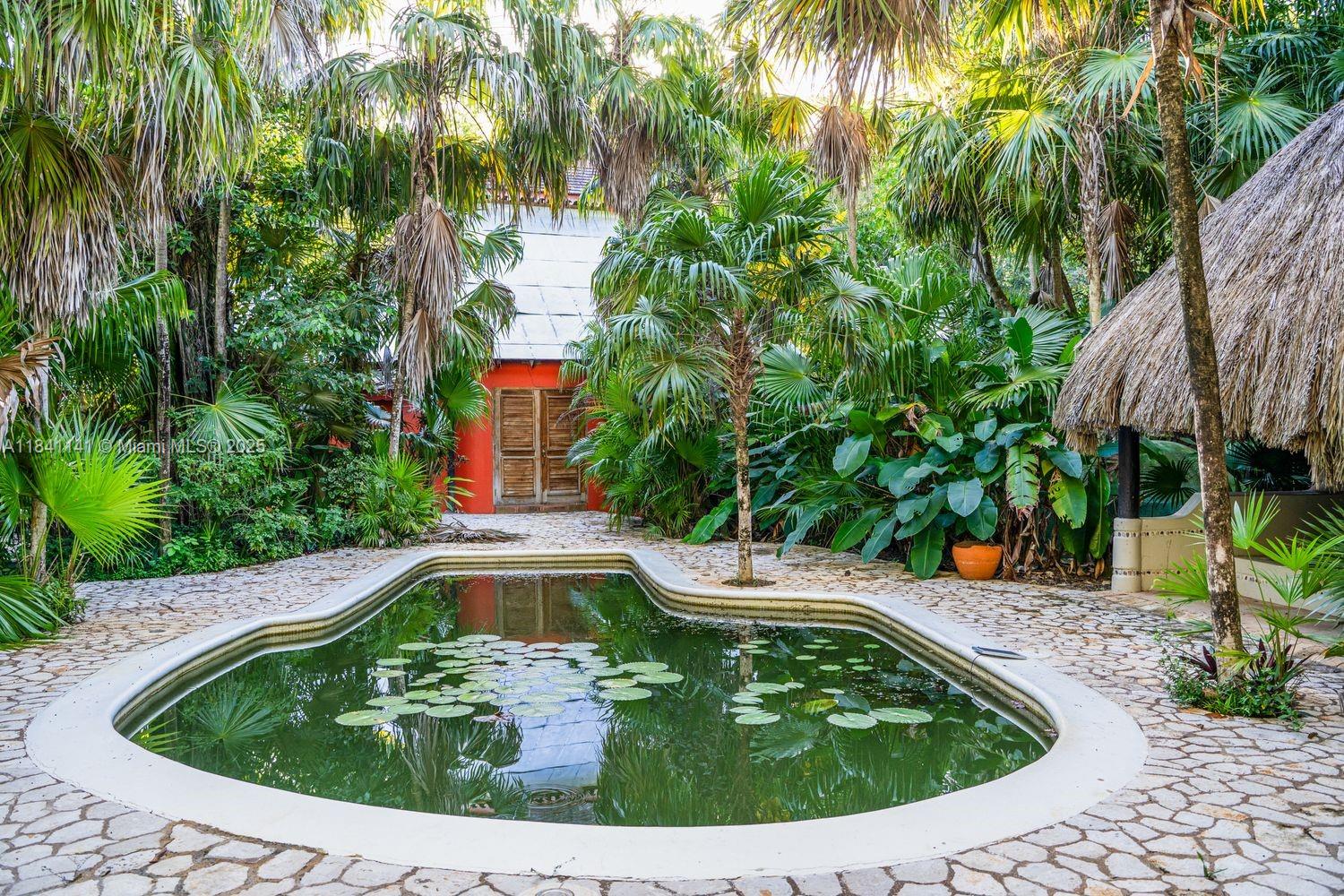 144 One Love Drive undefined, - 00000 - Photo 29 of 34 a view of a swimming pool with a garden