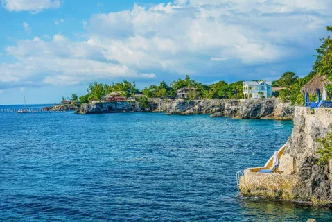 a view of a chairs and table in patio